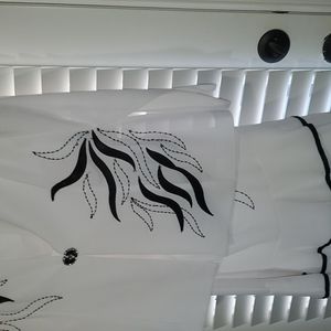 White and black Tally Taylor 3 piece woman's suit.